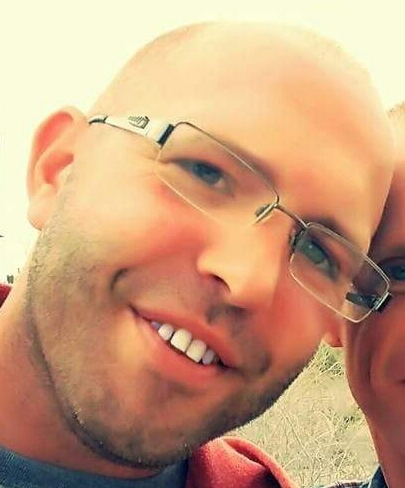 Filtered ghost like face image of Nate smiling.
