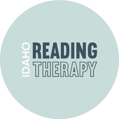 Secondary logo for Idaho Reading Therapy, featuring bold navy text on a pale teal circular background.